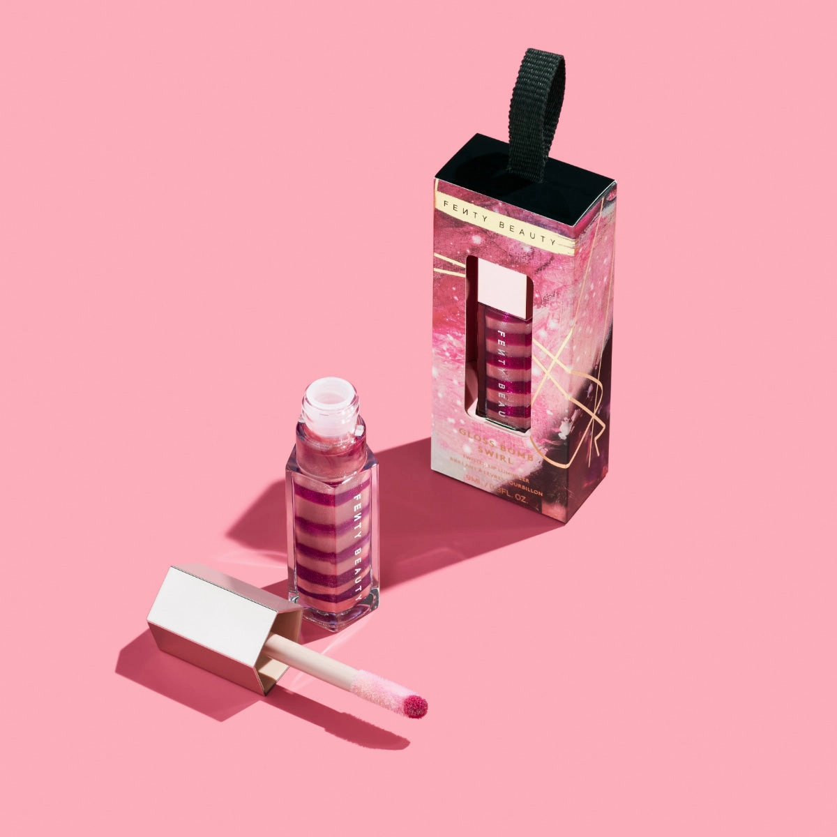 GLOSS BOMB SWIRL TWISTED LIP LUMINIZER - FU$$Y FLEX